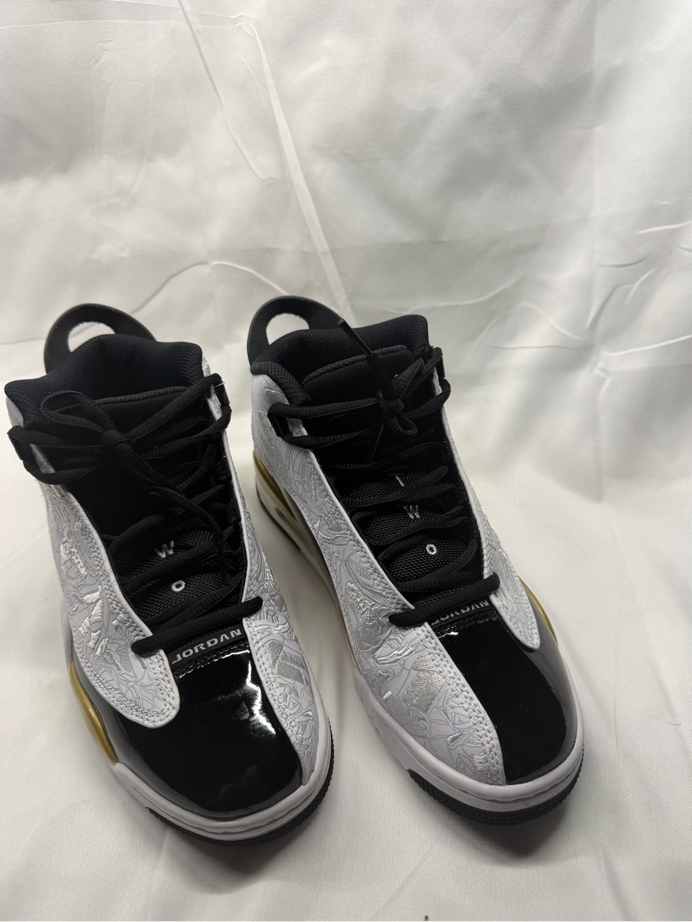 Jordan Black, White and Gold High-Top Sneakers